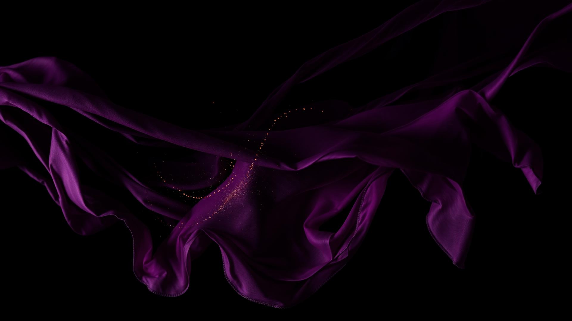 Purple silk fabric flowing with suspended gold dust